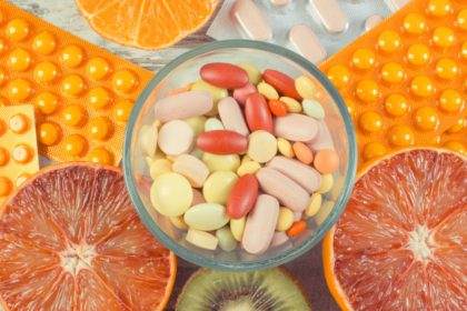 Natural fruits and medical pills. Choice between eating fruits and supplements