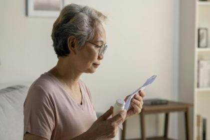 Senior woman taking medicine